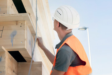 Wood technician working with wood outside