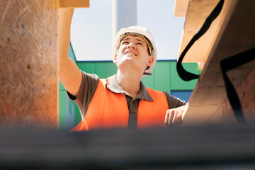 Wood technician working with wood outside