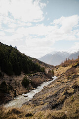 Mountain stream winding through rugged valley