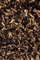 Pile of raw loose tobacco filing frame