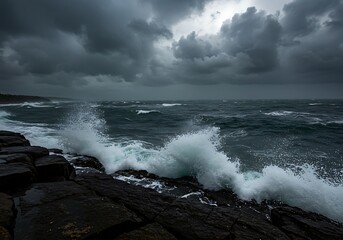 Fototapeta premium Stormy sea waves crashing on rocks under dark cloudy sky ocean water seascape nature photography