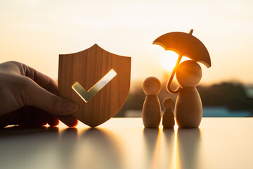Umbrella icon and family model, Security protection and health insurance. The concept of family home, protection, health care day, car insurance.	