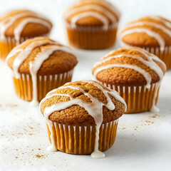 Pumpkin Muffins with White Glaze and Cinnamon Dus