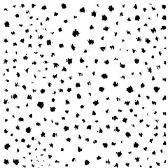A chaotic pattern of small, irregular black shapes scattered randomly over a white background, creating a textured appearance.