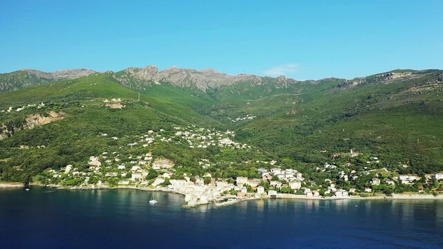The Panoramic View of Erbalunga captures an arid and green setting, in Europe, in France, in Corsica, towards Bastia, on the edge of the Mediterranean Sea, in summer, on a sunny day.&nbsp;