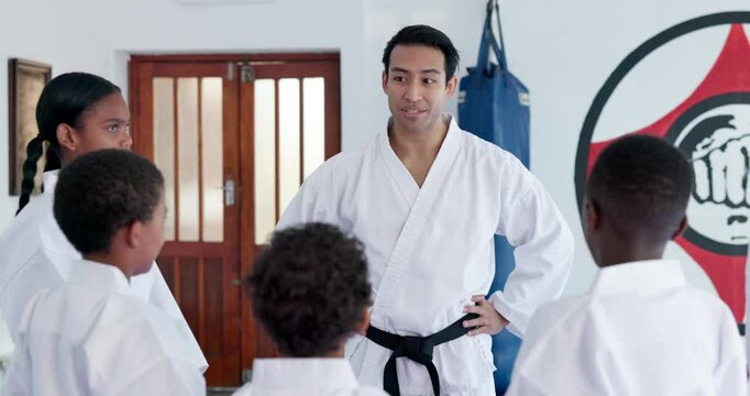 Teacher, students and karate class with talk for support, motivation and together for martial arts education. Mission, training goals and learning self defense, man and children with exercise in dojo