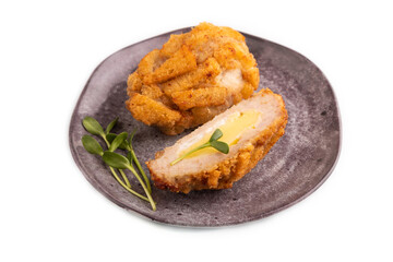 Chicken Schnitzel on gray plate with microgreen Isolated on white. side view, copy space