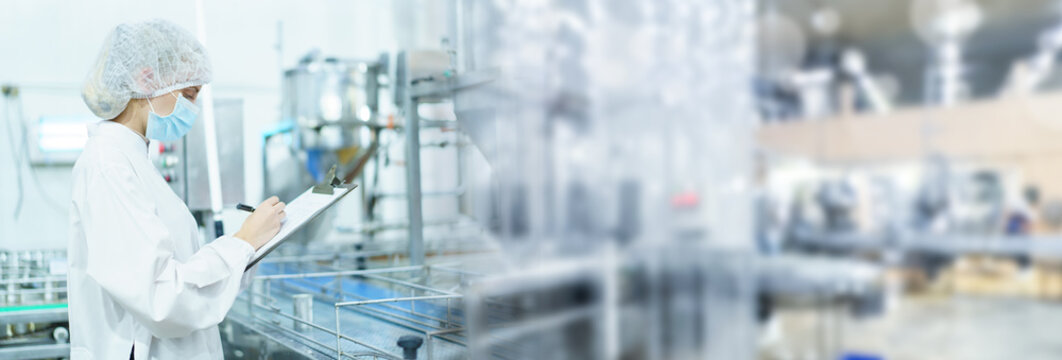 Quality control officer is randomly inspecting a raw materials in canned fish production facility.