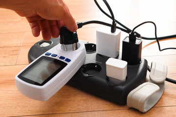 Overloaded power adaptor multiple socket. Surge Protector Power Strip, Phone Charger Cable. Plugs in Outlet