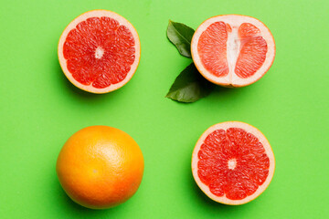 fresh Fruit grapefruit with Juicy grapefruit slices on colored background. Top view. Copy Space....