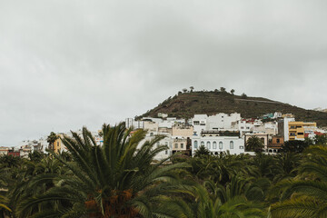Scenic View of Town Against Mountainous Landscape