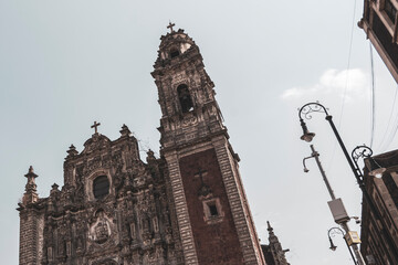 Old historical buildings house church cathedral construction in Mexico City.