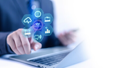 
IoT concept, Internet, Businessman pointing at digital icon, Smart Internet represents the Internet of Things (IoT), presenting modern technology and connectivity in a digital environment.