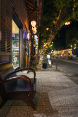 Cozy and atmosphere and colorful lights on the night streets of scenic area of old town in touristic quarters of Hoi An town in central Vietnam