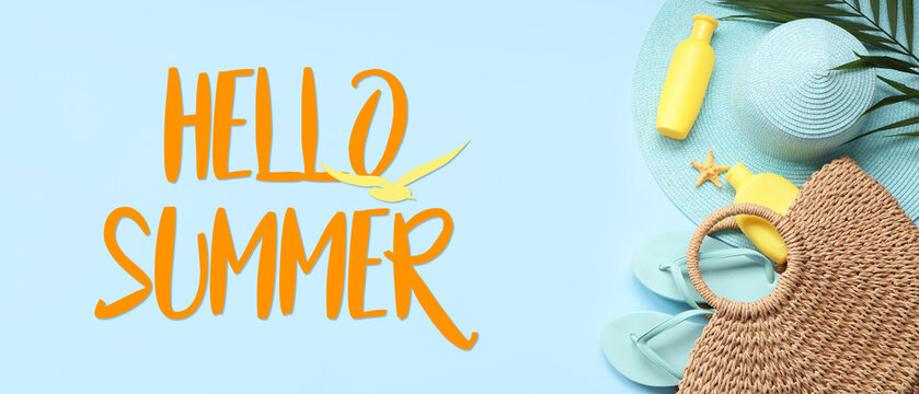 Beautiful composition with beach accessories and bottles of sunscreen on blue background