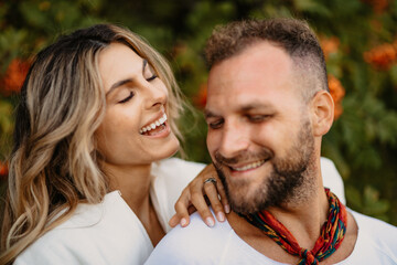 Fototapeta premium Happy couple smiling and embracing outdoors in nature
