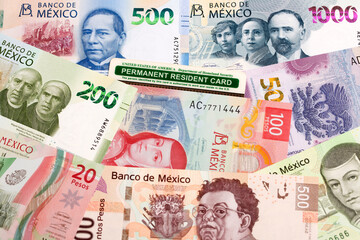 American permanent resident card on a Mexican money