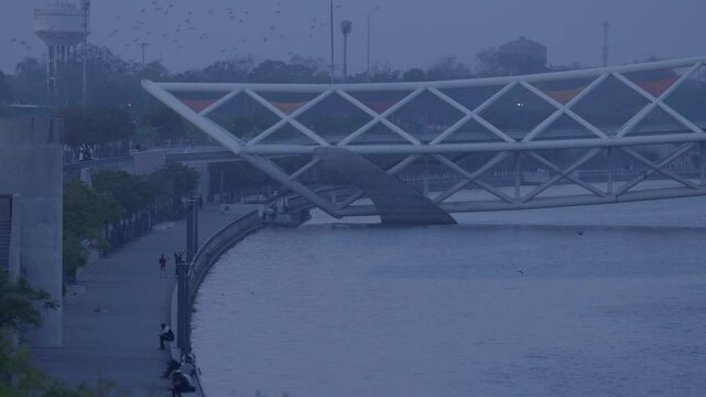 Atal Pedestrian Bridge is a pedestrian triangular truss bridge at Sabarmati Riverfront on Sabarmati River in Ahmedabad, Gujarat, India. It has a design inspired by kites.