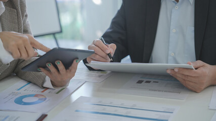 Business team briefing the idea and discussing exchange contract during brainstorming in office