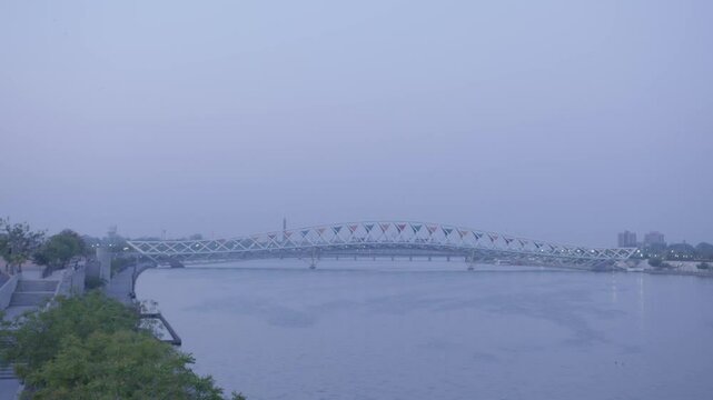 Atal Pedestrian Bridge is a pedestrian triangular truss bridge at Sabarmati Riverfront on Sabarmati River in Ahmedabad, Gujarat, India. It has a design inspired by kites.