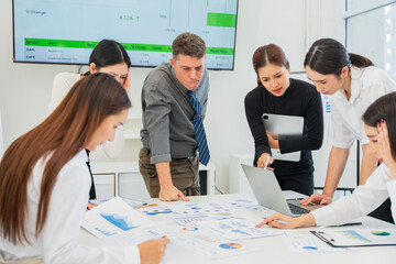 Group of business people are having a meeting and looking stressed about the work they are trying to solve.