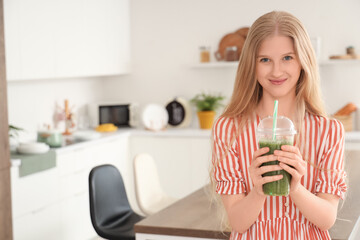 Young woman with healthy smoothie in kitchen