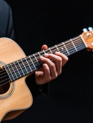 Fototapeta premium Close-up shot of a mariachi guitarists hands strumming strings against rich black background