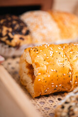 Soft Brownish Bread With Filling Sprinkled With Sesame Seeds. Looks Very Aesthetic And Appetizing.