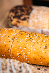 Soft Brownish Bread With Filling Sprinkled With Sesame Seeds. Looks Very Aesthetic And Appetizing.