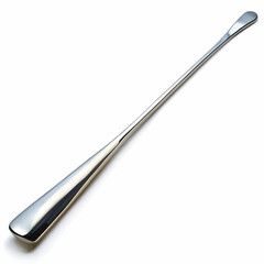 A long, polished steel shoehorn, with a sleek and smooth surface, isolated against a white background,