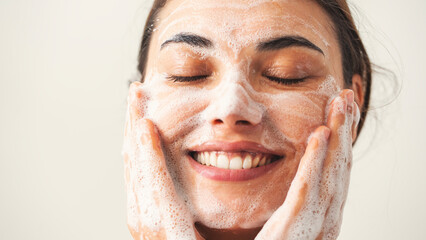 Beautiful woman washing her face