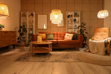 Interior of stylish living room with brown sofa, coffee table and glowing lamps at evening