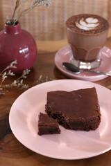 a pink plate of sliced brownies