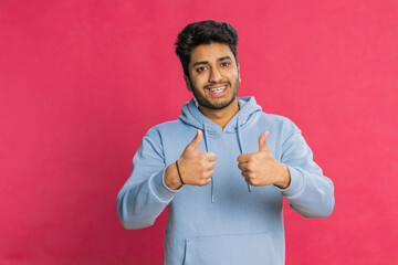 Like. Indian man raises thumbs up agrees with something or gives positive reply recommends...
