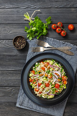 Barley salad with vegetables and walnuts in a bowl