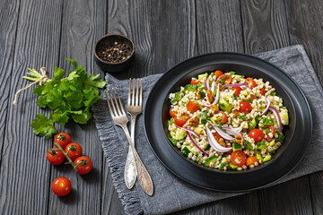 Barley salad with vegetables and walnuts in a bowl