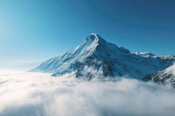 Snowy mountain peak above clouds
