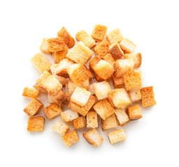 Pile of crunchy croutons isolated on white background, top view