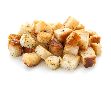 Pile of crunchy croutons with spices isolated on white background