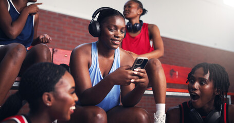 Phone, typing and headphones with black woman on basketball court for sports results, athlete scouting and online. Score tracking, training program and subscription with person and game updates