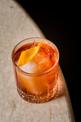 Amber Negroni Cocktail Icy Cube Orange Twist Elegant Glass