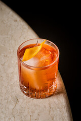 Negroni Cocktail Amber Liquid Ice Cubes and Orange Twist