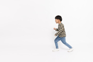Asian little boy walking isolated on white background, Full body composition and five years old