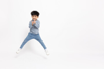 Asian little boy dancing happily isolated on white background, Five years old