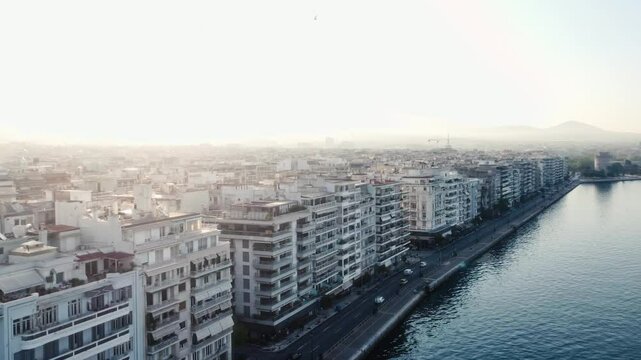 Drone shot of Thessaloniki, Leoforos Nikis street by the sea, with no people at morning time.