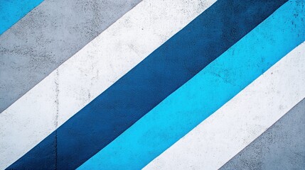 Fototapeta premium Diagonal stripes of white, gray, blue, and teal on a textured surface