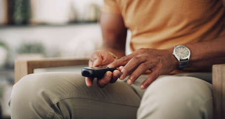 Home, hands and man with diabetes, testing for glucose levels and chronic disease. Closeup, healthcare and person in living room with medical meter, sugar and insulin machine to monitor hypertension