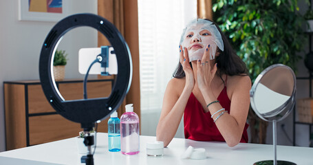 Online creator demonstrates face mask application and talks about her favorite beauty products....