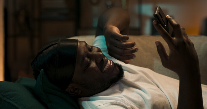 Boy talks with his girlfriend during an online video call. The couple maintains their relationship through virtual meetings and heartfelt chats.