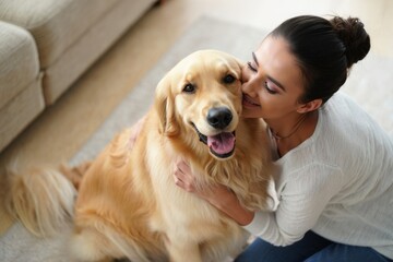 young beautiful woman with hairbun enjoying hugging her adorable pet